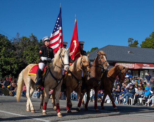 U.S. Marine Corps' Mounted Color Guard carries the American Flag and the Marine Corps Standard in the 135th Rose Parade in Pasadena, Calif., on Jan. 1, 2024. The Rose Parade is part of an annual celebration, Tournament of Roses, that includes various floats, bands, dancers and equestrian units, and is meant to showcase the beauty of Pasadena, Calif. (U.S. Marine Corps photo by Cpl. Kristina Judy)