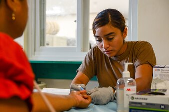 U.S. Navy Hospital Corpsman 3rd Class Jovana Ayaladiaz, checks a local Micronesian patient's blood sugar at Chuuk State Hospital in Chuuk, Federated States of Micronesia, as part of Pacific Partnership 2024-1 Jan. 11, 2024.