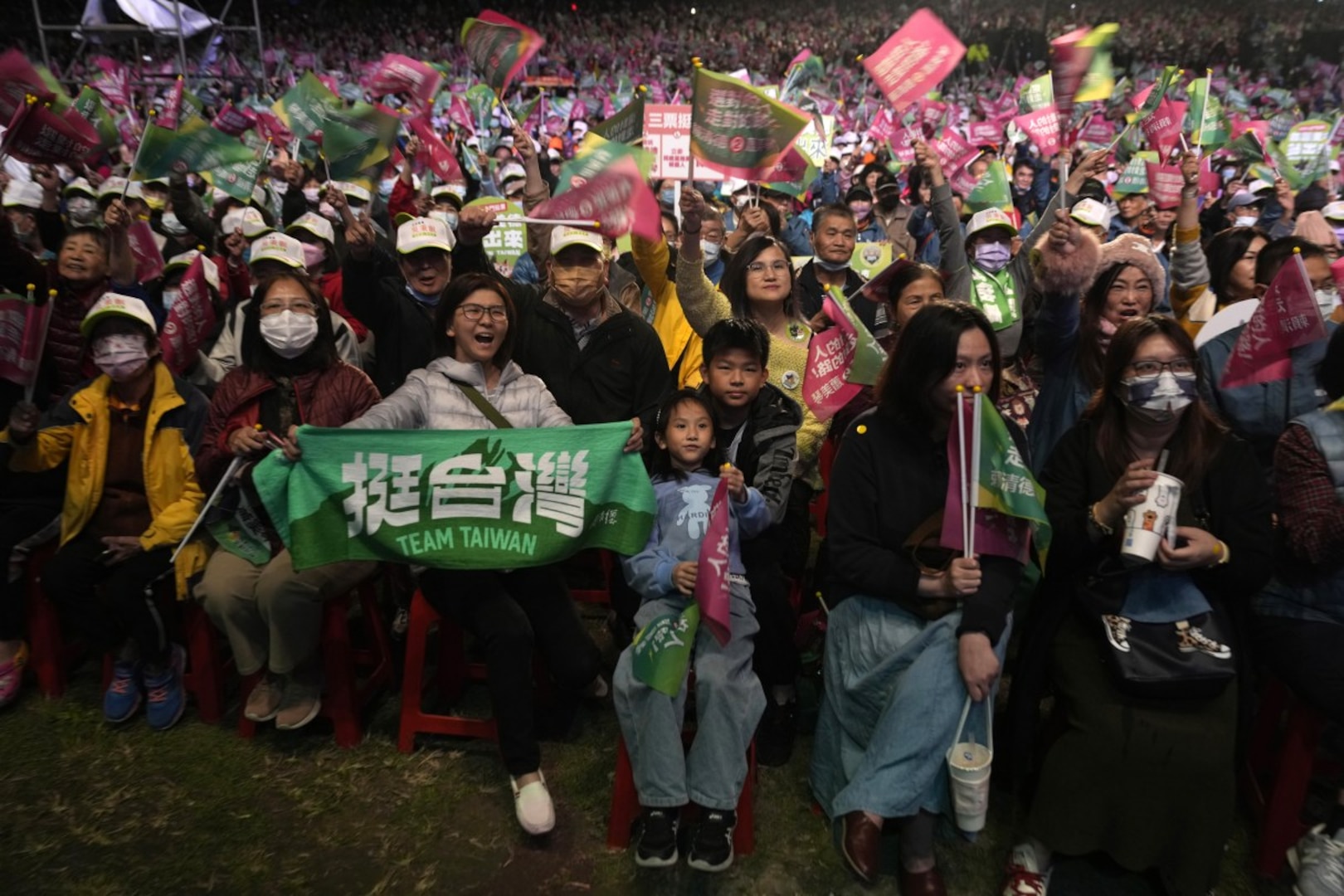 Supporters cheer for the Democratic Progressive Party during an elections rally in New Taipei City, Taiwan