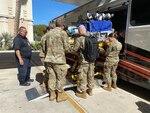 Army Maj. (Dr.) Christopher Stark (with backpack), a neonatology fellow at Walter Reed, joins with other military providers during training in military-specific transport for neonates at the Conference on Military Perinatal Research (COMPRA) in San Antonio in November.
