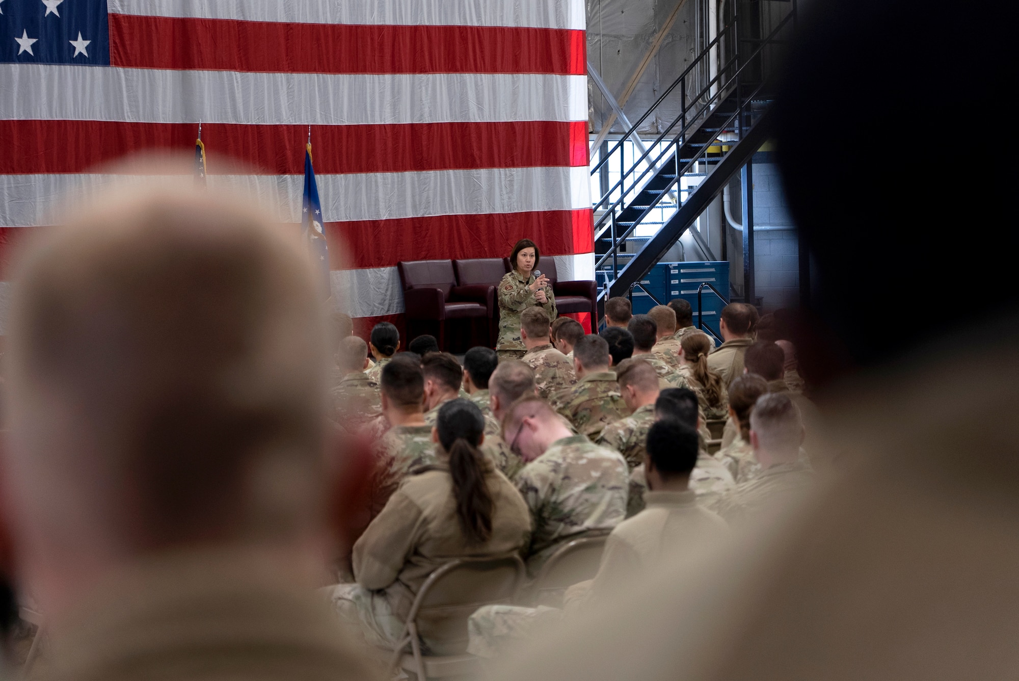 Chief Master Sgt. of the Air Force JoAnne S. Bass speaks at an all-call inside a hangar on Hill Air Force Base, Utah, Jan. 8, 2024.