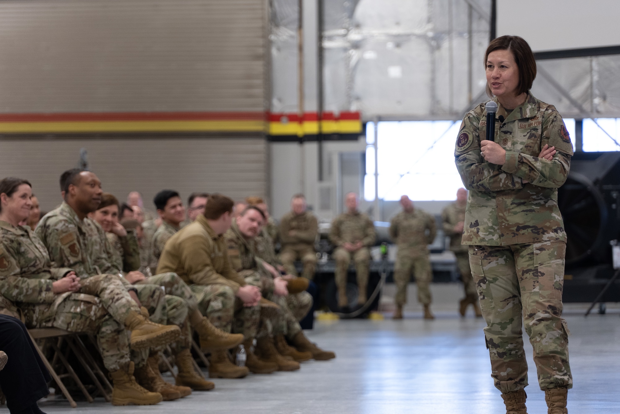 Chief Master Sgt. of the Air Force JoAnne S. Bass speaks at an all-call inside a hangar on Hill Air Force Base