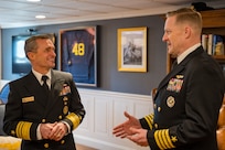 Vice Adm. Doug Perry, commander, U.S. 2nd Fleet, speaks with Capt. Rick Burgess, commanding officer of the Ford-class aircraft carrier USS Gerald R. Ford (CVN 78), in the commanding officer's in-port cabin as the ship prepares to return to Naval Station Norfolk following an eight-month deployment, Jan. 17, 2024. The Gerald R. Ford Carrier Strike Group was deployed to the U.S. Naval Forces Europe area of operations, employed by U.S. 6th Fleet to defend U.S., allied and partner interests.(U.S. Navy photo by Mass Communication Specialist 2nd Class Anderson W. Branch)