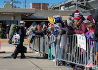 Sailors assigned to the Ford-class aircraft carrier USS Gerald R. Ford (CVN 78) along with the staff of carrier Strike Group (CSG) 12, greet their family members after the ship returned to Naval Station Norfolk following an eight-month deployment, Jan. 17, 2024. The Gerald R. Ford CSG was deployed to the U.S. Naval Forces Europe area of operations, employed by U.S. 6th Fleet to defend U.S., allied and partner interests. (U.S. Navy photo by Mass Communication Specialist 1st Class Ryan Seelbach)