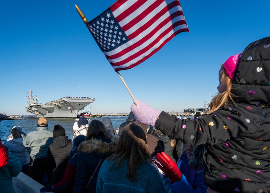 Families of Sailors assigned to the Ford-class aircraft carrier USS Gerald R. Ford (CVN 78), along with the staff of carrier Strike Group (CSG) 12, watch as the ship returns to Naval Station Norfolk following an eight-month deployment, Jan. 17, 2024. The Gerald R. Ford CSG was deployed to the U.S. Naval Forces Europe area of operations, employed by U.S. 6th Fleet to defend U.S., allied and partner interests. (U.S. Navy photo by Mass Communication Specialist 1st Class Ryan Seelbach)