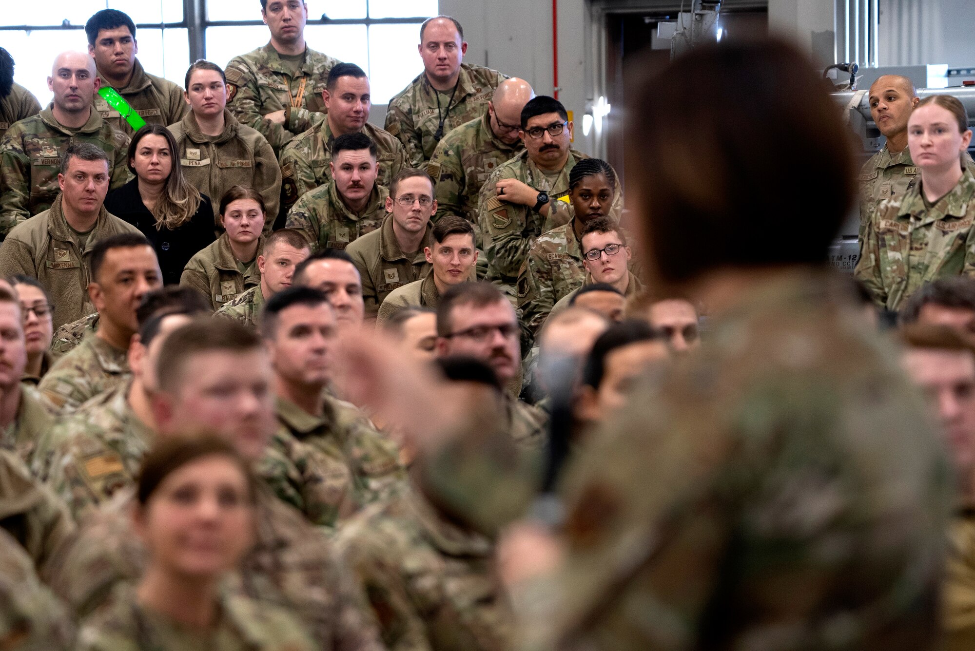 Airmen attend an all-call held by Chief Master Sgt. of the Air Force JoAnne S. Bass inside a hangar on Hill Air Force Base, Utah, Jan. 8, 2024.