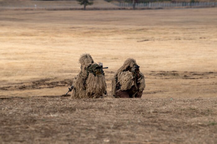 Soldiers from the Japan Ground Self-Defense Force 1st Airborne Brigade conduct a simulated reconnaissance during the annual New Year's Jump exhibition at Camp Narashino, Japan, Jan. 7, 2024. The New Year's Jump not only brought together U.S. and Japanese forces, but also created a platform for international allies and partners to collaborate. (U.S. Air Force photo by Airman 1st Class Natalie Doan)
