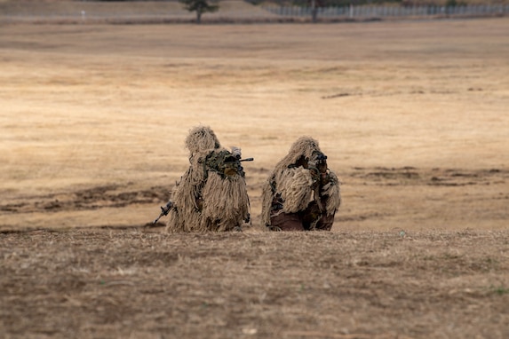 Soldiers from the Japan Ground Self-Defense Force 1st Airborne Brigade conduct a simulated reconnaissance during the annual New Year's Jump exhibition at Camp Narashino, Japan, Jan. 7, 2024. The New Year's Jump not only brought together U.S. and Japanese forces, but also created a platform for international allies and partners to collaborate. (U.S. Air Force photo by Airman 1st Class Natalie Doan)