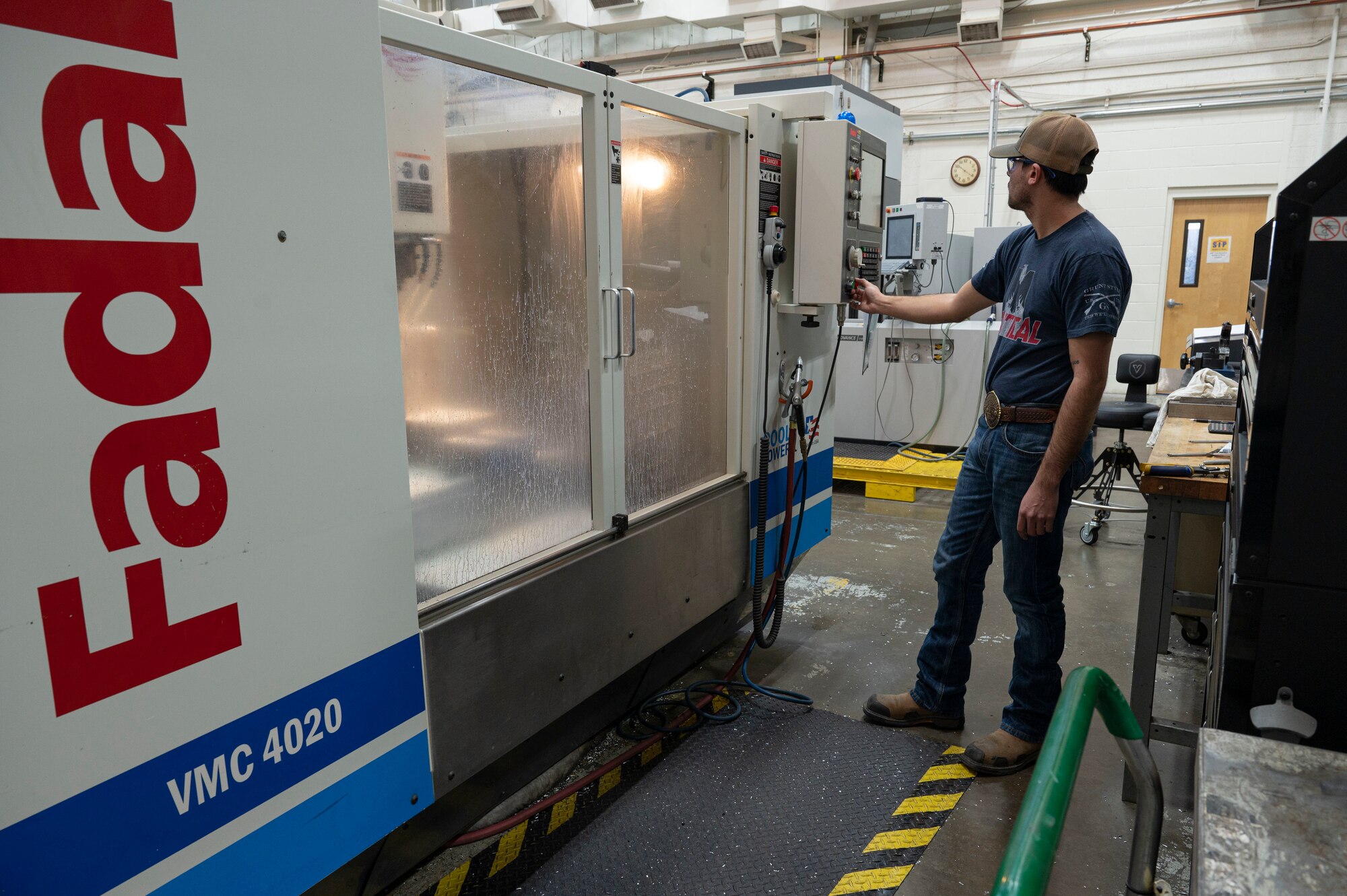 Richard Schnell, 846th Test Squadron machine tool operator, operates a fadal vertical milling machine at Holloman Air Force Base, New Mexico, Jan. 10, 2024. The fadal creates 3D holes in blocks used to assemble materials needed for the 846th TS, safety testing and weapons utilized by the Department of Defense. (U.S. Air Force photo by Airman 1st Class Michelle Ferrari)