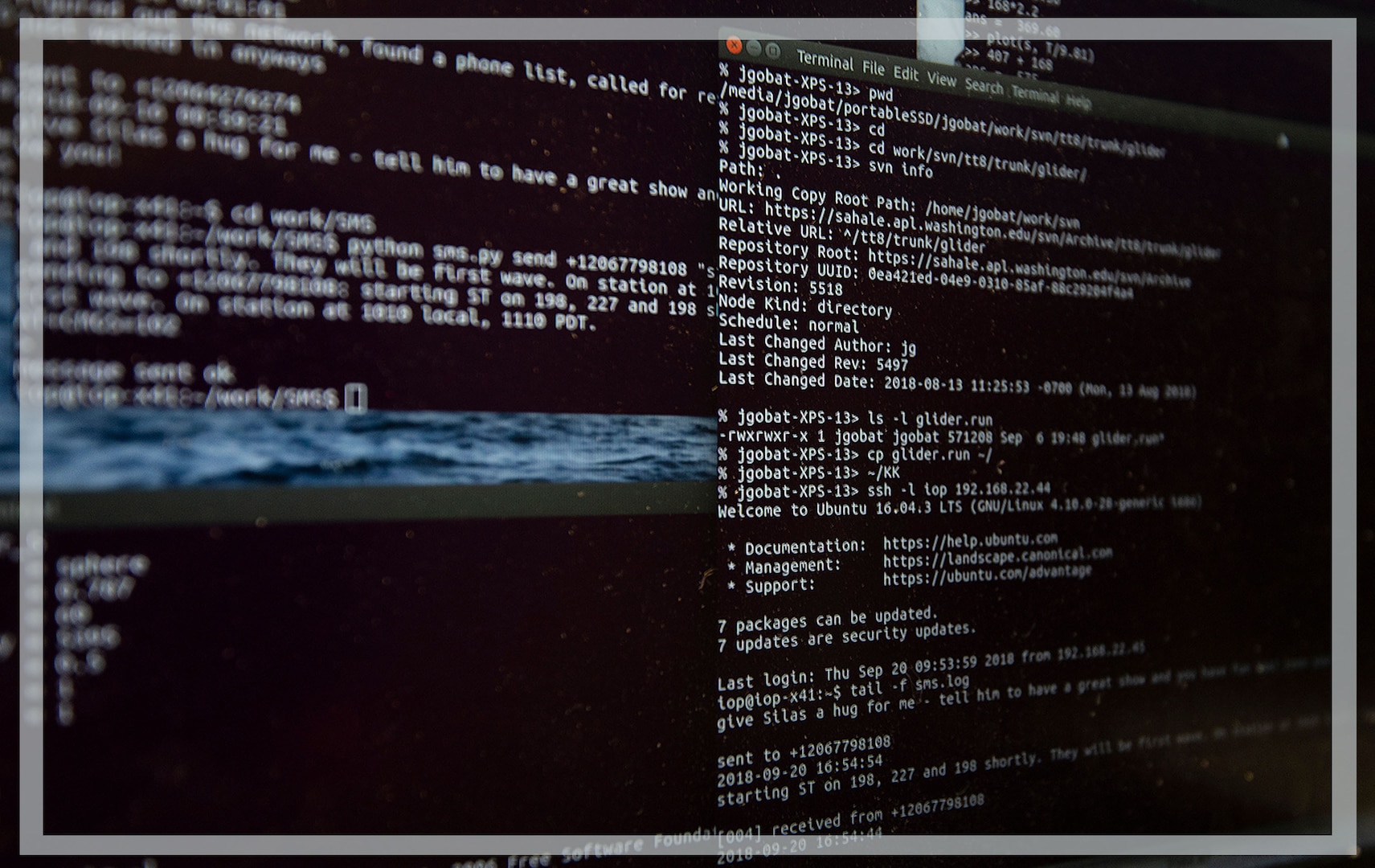 A photo of a black computer screen with code or some sort of text shown.