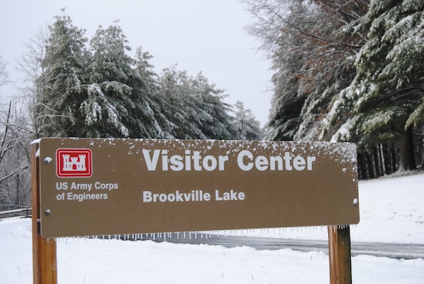 Visitor Center sign at Brookville Lake in Brookville, Indiana on a snowy day.