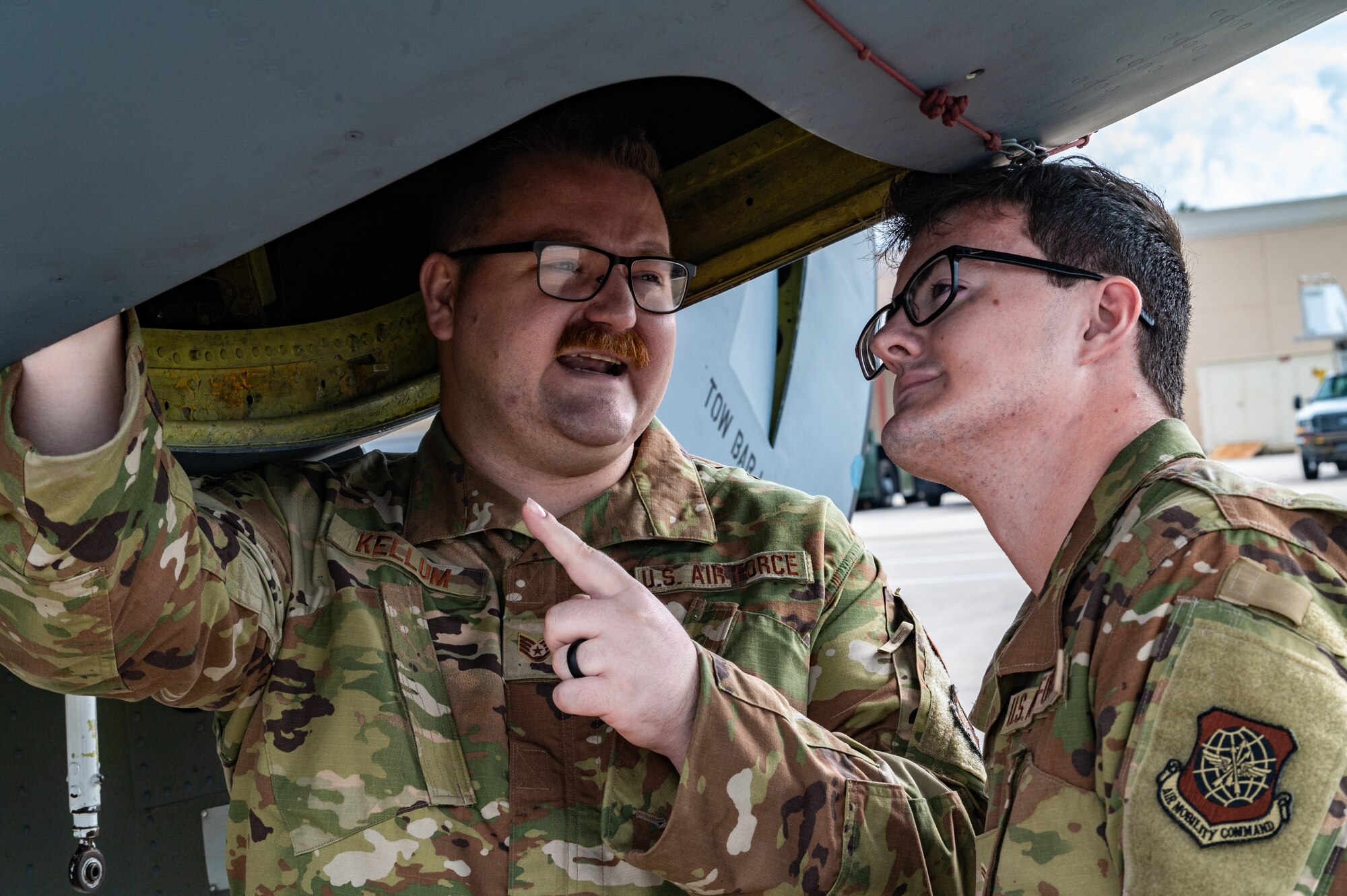 U.S. Air Force Staff Sgt. Benjamin Kellum, a crew chief assigned to the 6th Aircraft Maintenance Squadron, teaches Airman 1st Class Jacob Scott, a crew chief assigned to the 6th AMXS, about components on a KC-135 Stratotanker at MacDill Air Force Base, Florida, Jan. 16, 2024.