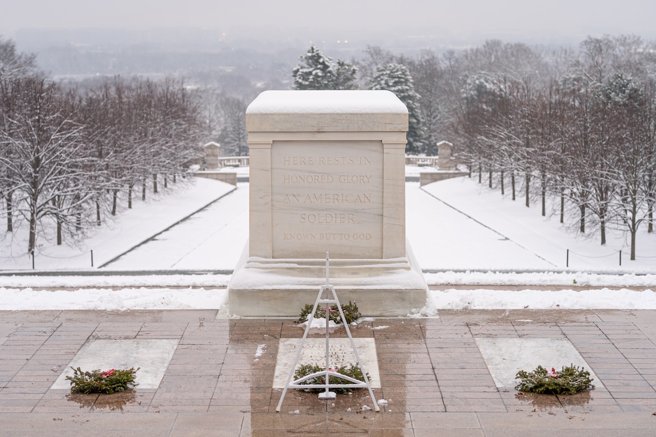 Snow falls at the Tomb of the Unknown Soldier at Arlington National Cemetery.