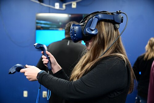Molly Turk, 17th Training Wing honorary commander, uses virtual reality gear at the 17th Training Support Squadron Instructional Technology Unit, Goodfellow Air Force Base, Texas, Jan. 12, 2024. The honorary commanders watched and experienced the 17th TRSS ITU’s mission and how they support training and daily operations across the 17th TRW. (U.S. Air Force photo by Airman 1st Class Madison Collier)