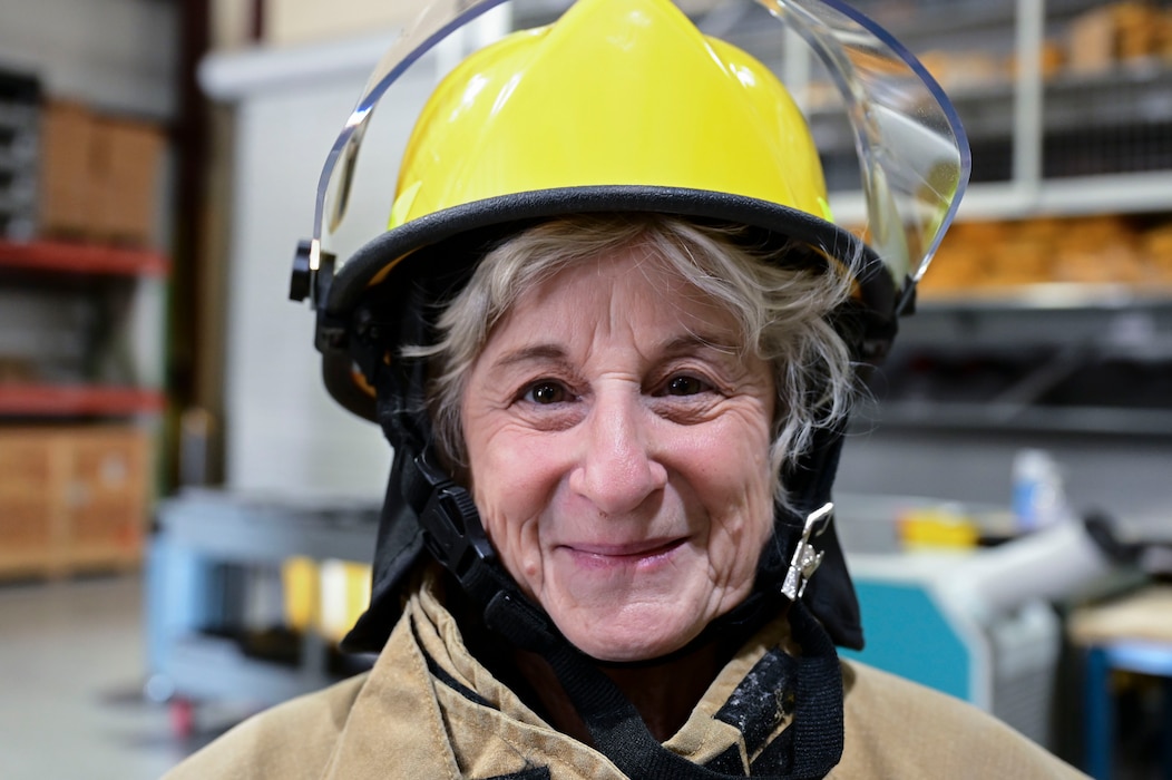 Pam Callan, 17th Training Wing honorary commander, smiles during the 17th Training Group immersion at the Louis F. Garland Department of the Defense Fire Academy, Goodfellow Air Force Base, Texas, Jan. 12, 2024. The honorary commander program is implemented to integrate local community leaders into Goodfellow’s mission and maintain strong bonds with the community of San Angelo. (U.S. Air Force photo by Airman 1st Class Madison Collier)