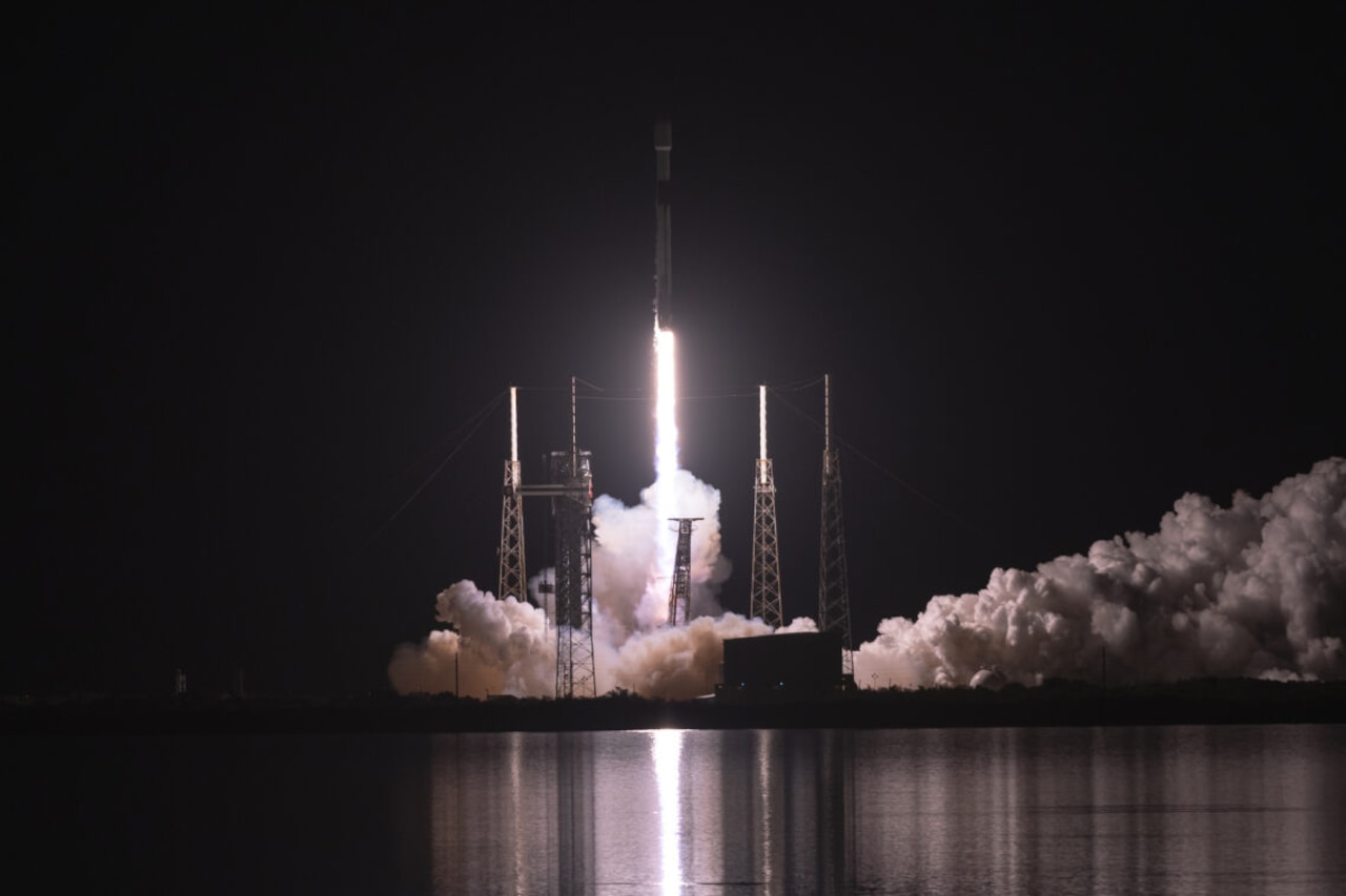 A rocket launches from a platform.