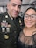 Male Soldier in a U.S. Army dress uniform poses in a selfie with female in a black formal dress