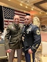 Two Soldiers in their dress uniforms pose together at a ceremony