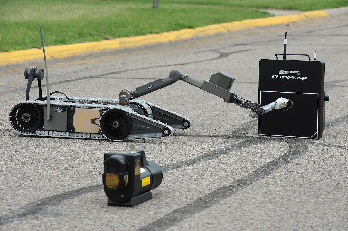 An EOD robot remotely operated by members of the 5th Civil Engineer Squadron explosive ordnance disposal, performs diagnostics on a simulated pipe bomb during an exercise here June 6. The robot is used by 5th CES EOD personnel to recon areas not cleared for human entry and disarming potential explosive devices. Exercises like these are vital training tools used throughout the year to ensure wing personnel are trained to provide safe, secure, effective conventional and nuclear operations as mandated by Air Force Global Strike Command.