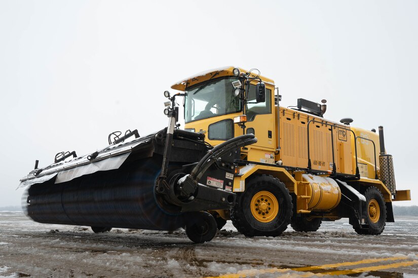 A snow-removal vehicle clears the flightline of snow during a winter storm at Joint Base McGuire-Dix-Lakehurst, N.J., Jan. 16, 2024. Airmen assigned to various JB MDL squadrons maneuvered through harsh conditions to keep the mission going despite several base closures due to safety concerns. (U.S. Air Force photo by Airman 1st Class Aidan Thompson)