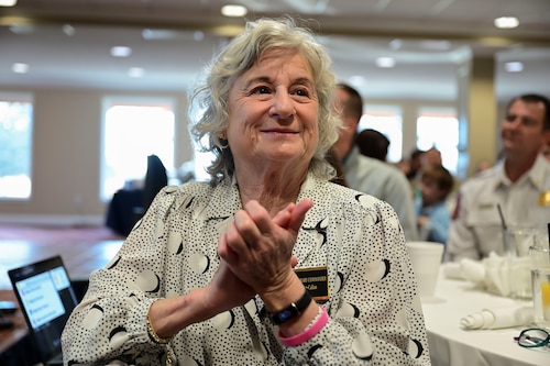 Pam Callan, 17th Training Wing honorary commander, claps during 17th Training Group annual awards ceremony at the San Angelo Country Club, San Angelo, Texas, Jan. 12, 2024. The honorary commanders started their day off with the opportunity to interact and have breakfast with members of the 17th TRG. (U.S. Air Force photo by Airman 1st Class Madison Collier)