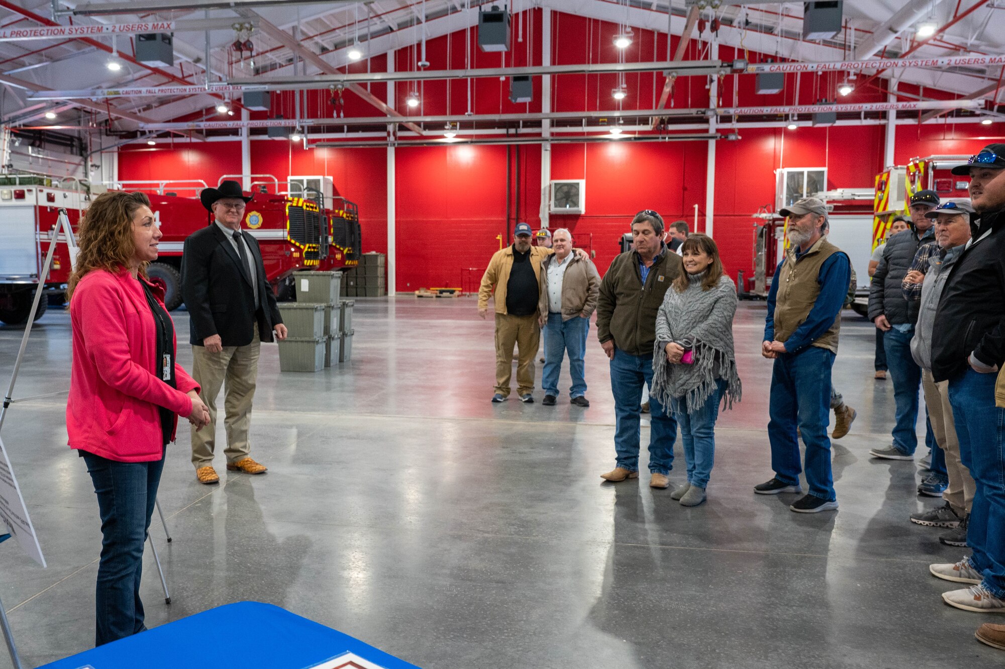 Lori Stevens, 97th Civil Engineer Squadron environmental program manager, meets with Altus agricultural members inside the firehouse during the Airpower and Agriculture: Base Tour at Altus Air Force Base, Oklahoma, Jan. 12, 2024. Stevens explained several programs that help conserve wildlife on base and support Airmen. (U.S. Air Force photo by Airman First Class Heidi Bucins)