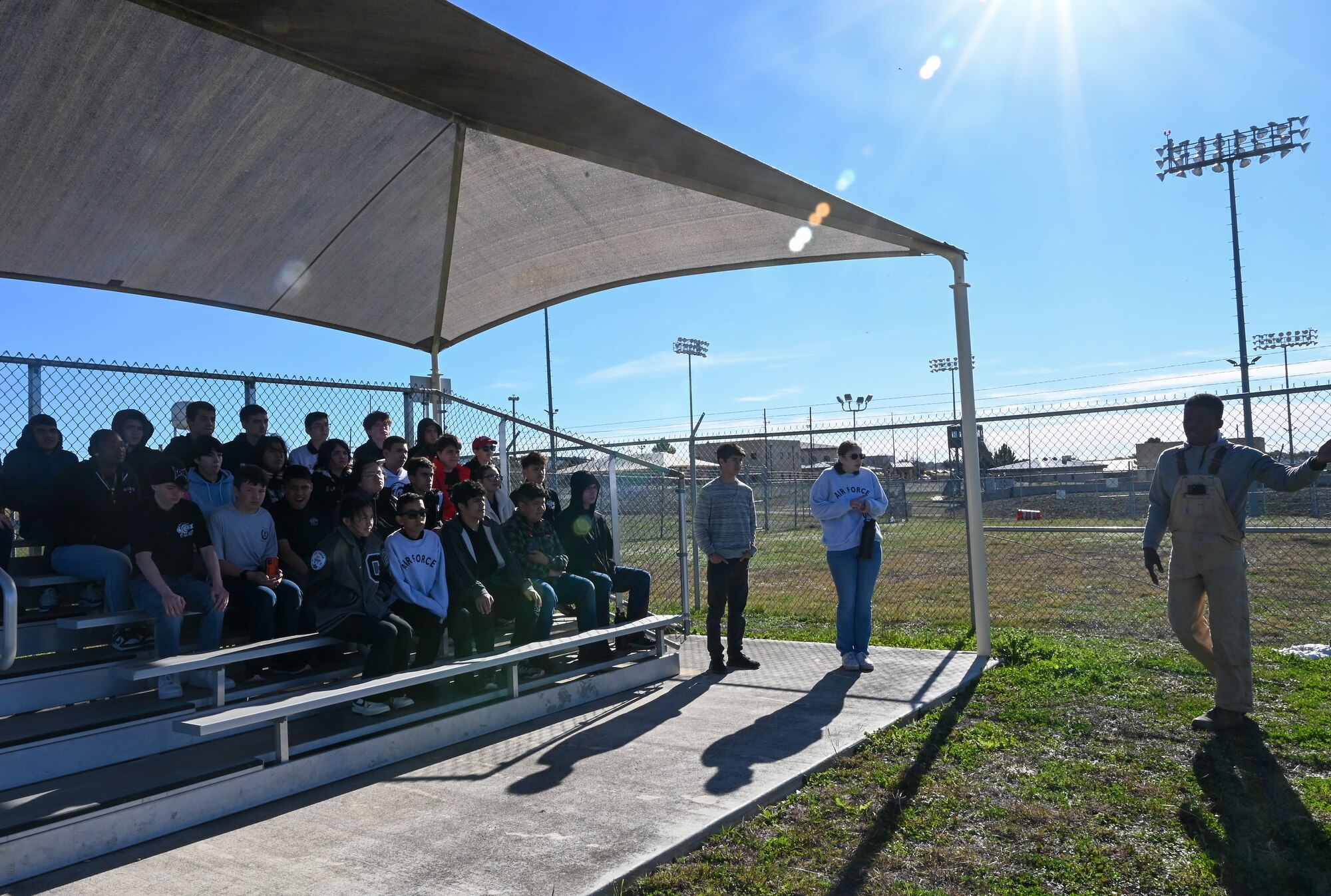 Staff Sgt. Tariq Russell, 802nd Security Forces Squadron military working dog handler, narrates a MWD demonstration to 29 Junior Reserve Officer Training Corps students from the Thomas C. Clark High School at Joint Base San Antonio- Medina Annex, Texas, Jan. 12, 2024.