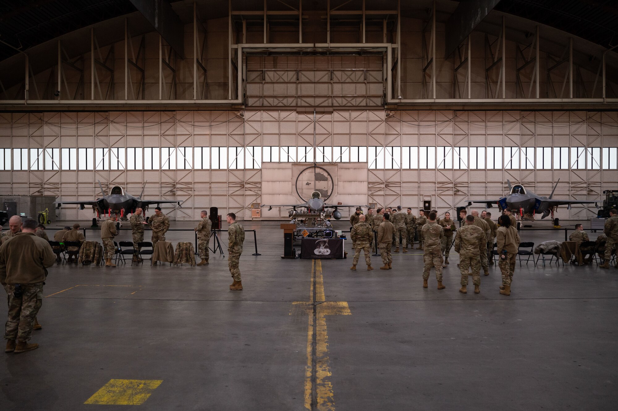 U.S. Air Force Airmen wait in the Thunderdome in preparation for a load competition with two F-35A Lightning II’s and one F-16 Fighting Falcon on Eielson Air Force Base, Alaska, Jan. 11, 2024.