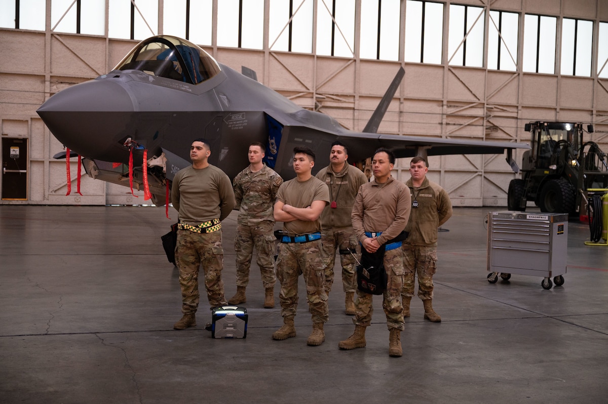 U.S. Air Force Airmen assigned to the 355th Fighter Generation Squadron stand ready for a load competition on Eielson Air Force Base, Alaska, Jan. 11, 2024.