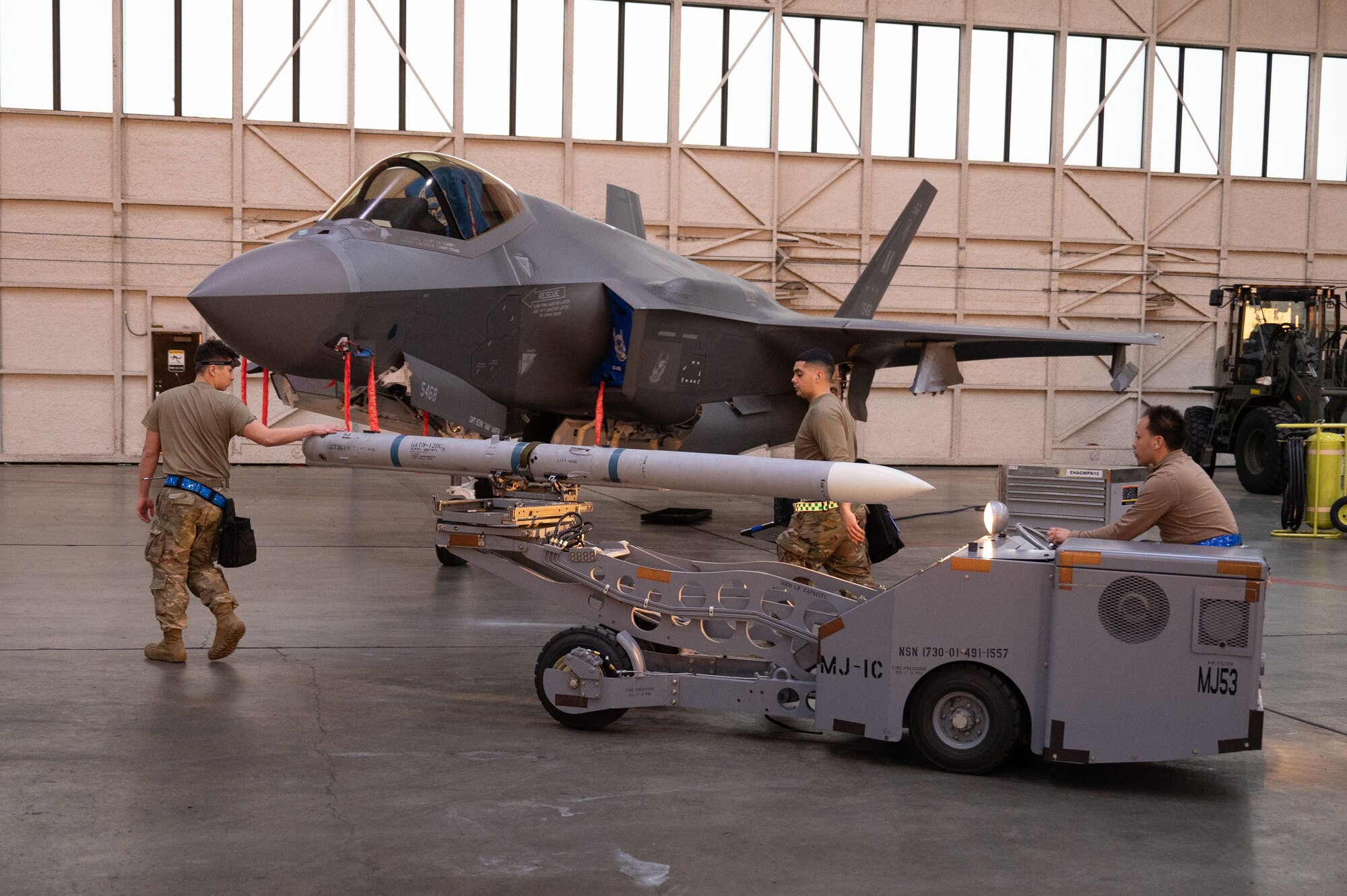 U.S. Air Force Airmen assigned to the 355th Fighter Generation Squadron prepare to load munitions during a load competition on Eielson Air Force Base, Alaska, Jan. 11, 2024.