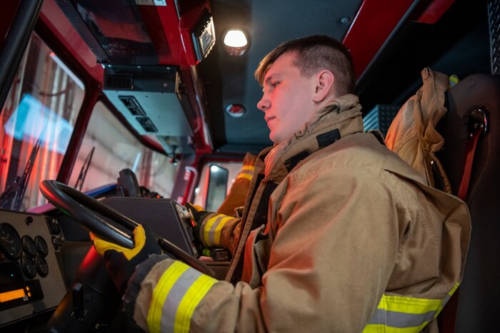 U.S. Air Force Senior Airman Ethan Embrey, 35th Civil Engineer Squadron firefighter sits in the driver seat of a Fire Engine at Misawa Air Base, Japan, Jan. 16, 2024.