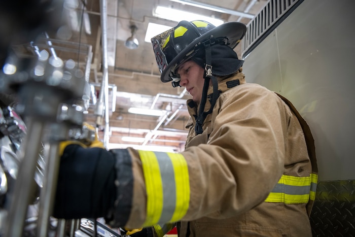U.S. Air Force Senior Airman Ethan Embrey, 35th Civil Engineer Squadron firefighter, operates Fire Engine Pump controls at Misawa Air Base, Japan, Jan. 16, 2024.