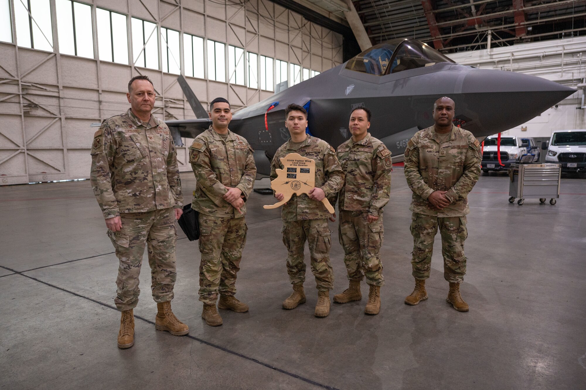 U.S. Air Force Airmen pose for a photograph after a load competition on Eielson Air Force Base, Alaska, Jan. 11, 2024.