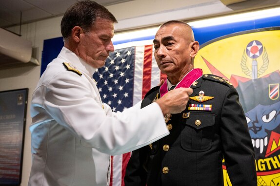 Gen. Chalermphon Srisawasdi, former Royal Thai Armed Forces (RTARF) Chief of Defence, receives the Legion of Merit pinned by Adm. John C. Aquilino, Commander of U.S. Indo-Pacific Command, at a ceremony in Bangkok on Jan. 18, 2024. The Legion of Merit is the highest accolade that the U.S. can bestow upon a foreign leader; it is reserved for individuals who have shown exceptionally meritorious conduct in the performance of outstanding services. USINDOPACOM is committed to enhancing stability in the Indo-Pacific region by promoting security cooperation, encouraging peaceful development, responding to contingencies, deterring aggression and, when necessary, fighting to win. (U.S. Navy photo by Chief Mass Communication Specialist Shannon M. Smith)
