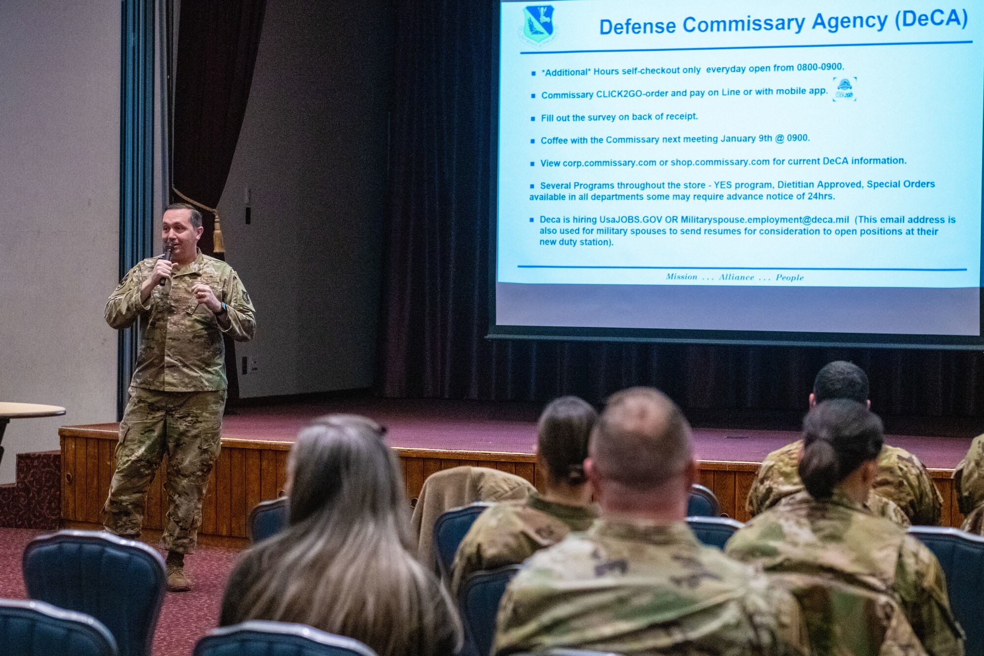 A photo of Airmen and civilians