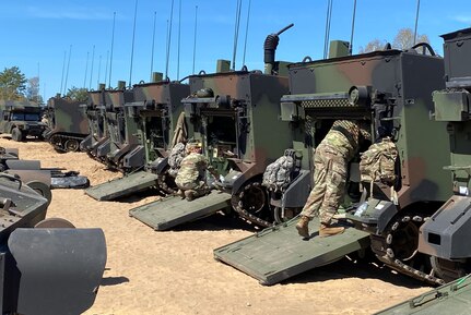 Army Field Support Battalion-Germany issues Army Prepositioned Stocks-2 equipment to National Guard Soldiers from the 28th Infantry Division during the DEFENDER exercise in Lithuania in May of 2022. Army Cpt. Andrew Marvets was a company commander deployed to Europe when he observed this equipment issue and first started to understand the capabilities of APS-2. Now, he’s the operations officer for AFSBn-Germany, and APS-2 is his business. (U.S. Army courtesy photo)