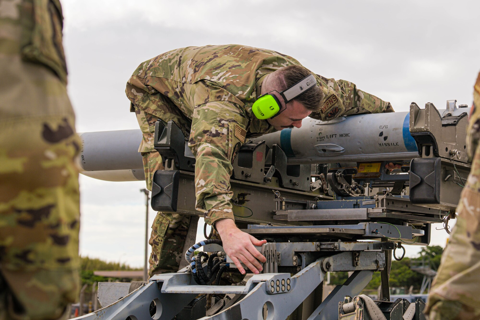 Airman prepares to load munitions