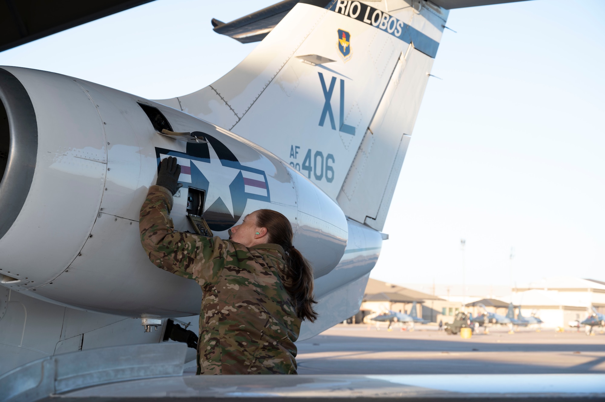 U.S. Air Force Capt. Tabitha Letourneau, 86th Flying Training Squadron instructor pilot, inspects the tail of a T-1A Jayhawk at Laughlin Air Force Base, Texas, Jan. 9, 2024. Letourneau is the first instructor pilot to fly with an unrated student pilot in the Air Force, a new change in policy brought to fruition by Letourneau and the Department of the Air Force Women’s Initiative Team. (U.S. Air Force photo by Senior Airman Kailee Reynolds)