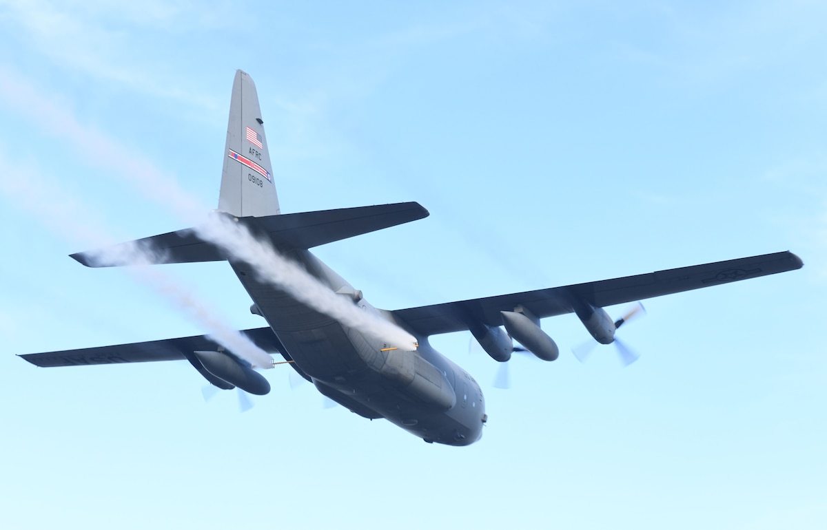 A 910th Airlift Wing aerial spray modified C-130H Hercules sprays water from its training modular aerial spray system during an aerial spray demonstration, Jan. 10, 2024, at the Manatee County Regional Airport, Florida.