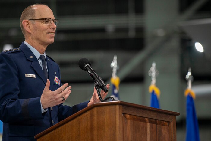Man standing behind podium giving speech.