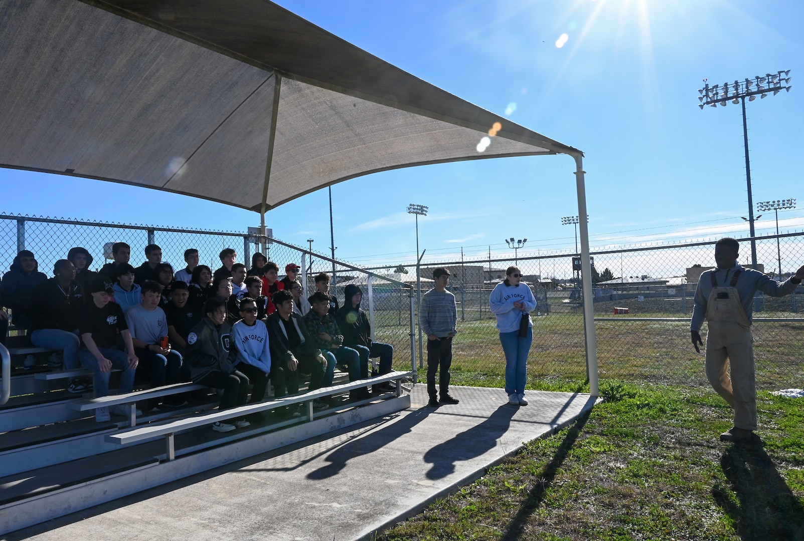 Staff Sgt. Tariq Russell, 802nd Security Forces Squadron military working dog handler, narrates a MWD demonstration to 29 Junior Reserve Officer Training Corps students from the Thomas C. Clark High School at Joint Base San Antonio- Medina Annex, Texas, Jan. 12, 2024.