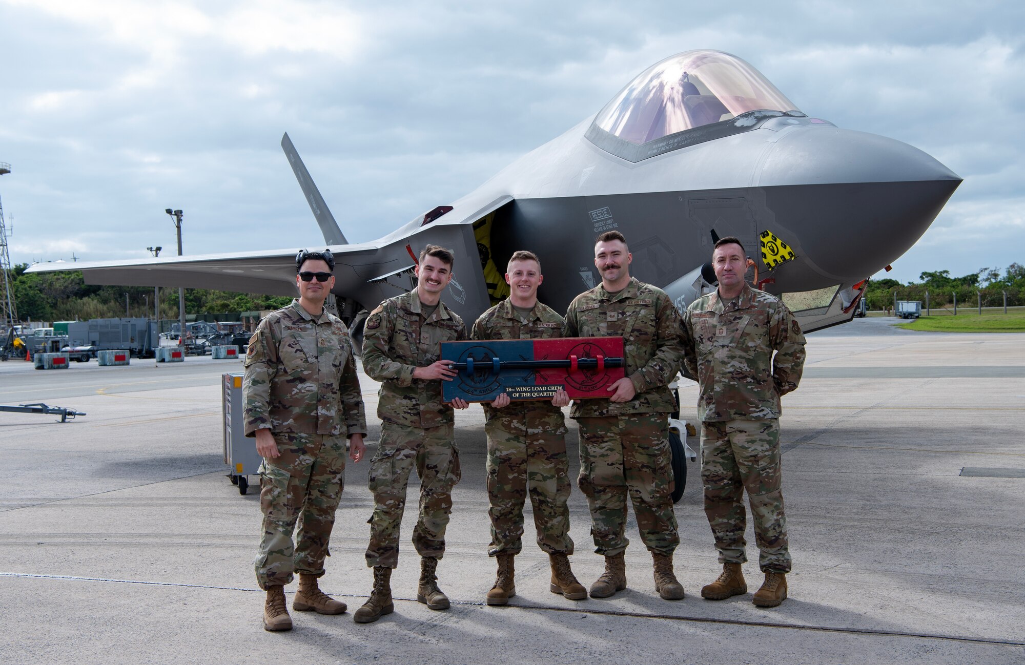 winners of the load competition pose with the trophy