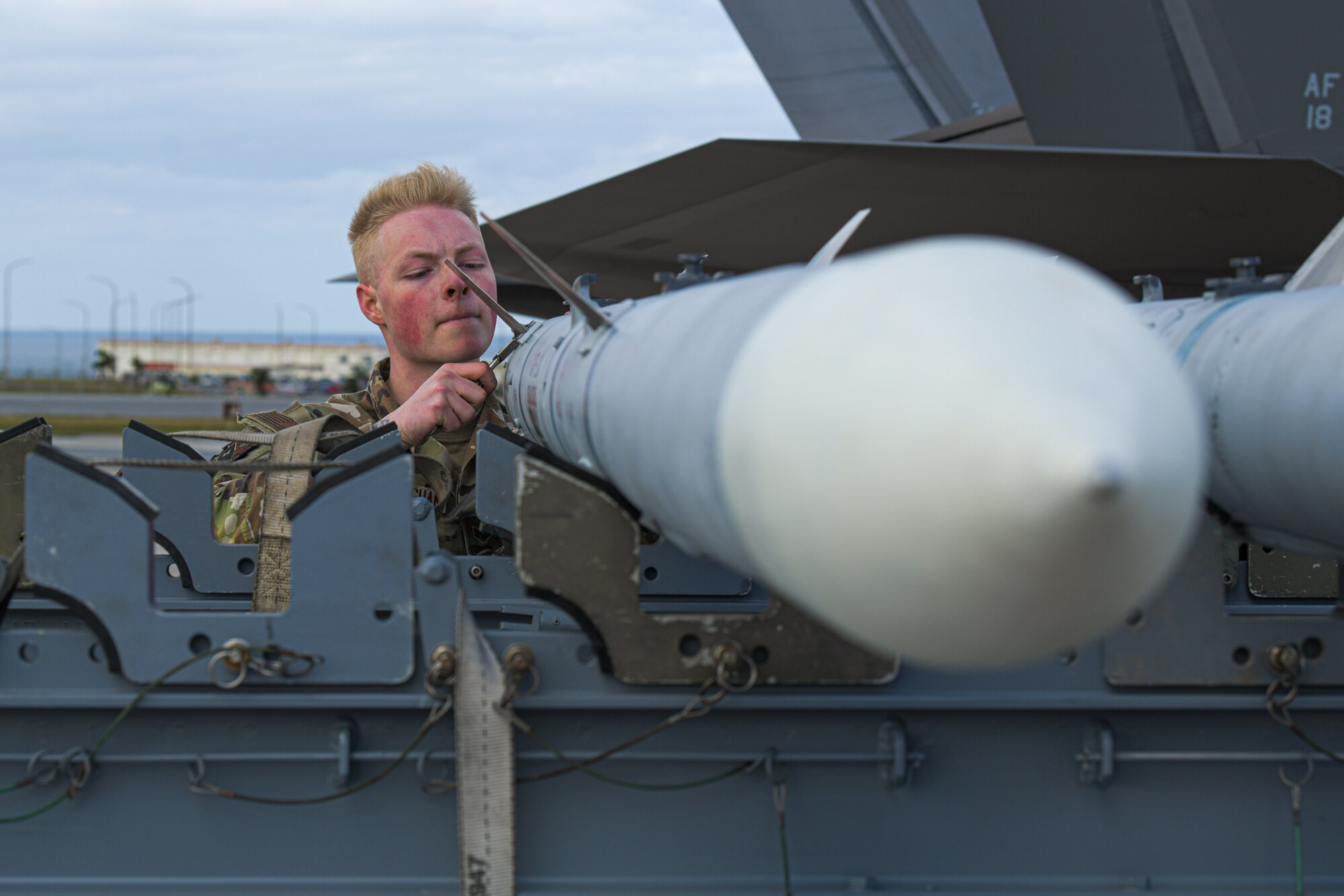 Airman prepares to load munitions