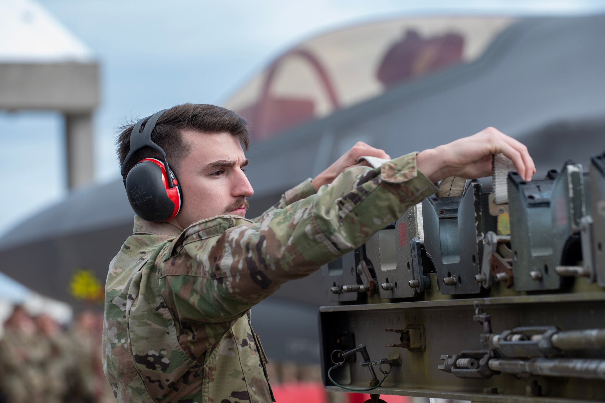 Airman loading munitions