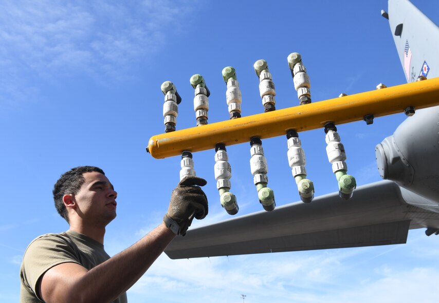 Staff Sgt. Bryce Cooper, aerial spray technician assigned to the 757th Airlift Squadron, readies the 910th Airlift Wing’s modular aerial system, Jan. 7, 2024, for a C-130H Hercules aerial spray demonstration at the Manatee County Regional Airport, Florida.