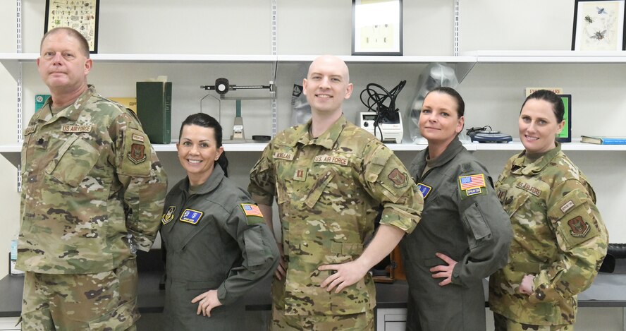 From left to right, Lt. Col. Karl Haagsma, 1st Lt. Bethany Eutsey, Capt. Benjamin McMillan, Lt. Col. Jennifer Remmers and Capt. Deanna Scheff, medical entomologists assigned to the 757th Airlift Squadron, celebrate a successful Department of Defense Aerial Spray Category 11 Applicator Course at Manatee County Mosquito Control District’s Headquarters, Florida, from Jan. 8-11, 2024.