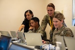 U.S. Air Force personnel assigned to the 36th Medical Group learn to use the Military Health System Genesis program at Andersen Air Force Base, Guam, Jan. 12, 2024. MHS Genesis is an advanced electronic health record, that has replaced several legacy systems. (U.S. Air Force photo by Airman 1st Class Allon Lapaix)