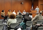 The Naval Surface Warfare Center, Philadelphia Division (NSWCPD) Women’s Employee Resource Group (WERG) Chair and Solid Waste and Hazardous Materials In-Service Engineering Branch Manager Allyson Jones-Zaroff (podium, left) and African American Employee Resource Group (AAERG) Secretary and Mechanical Engineer Taylor Barnett (podium, right) moderate the command’s Women’s Leadership Panel for a hybrid audience on Nov. 29, 2023. Panel members included (from left to right): Deputy Human Resource Director Keirston Graves; Comptroller Department Head Joyce Hall; Platforms Division Surface Ship Maintenance, Modernization and Sustainment (SEA21) Portfolio Manager Mia Korngruen; Propulsion, Power and Auxiliary Machinery Systems Department Head Karen Dunlevy-Miller; and Submarine Life Support R&D Lead Jay Smith. (U.S. Navy Photo by Phil Scaringi/Released)