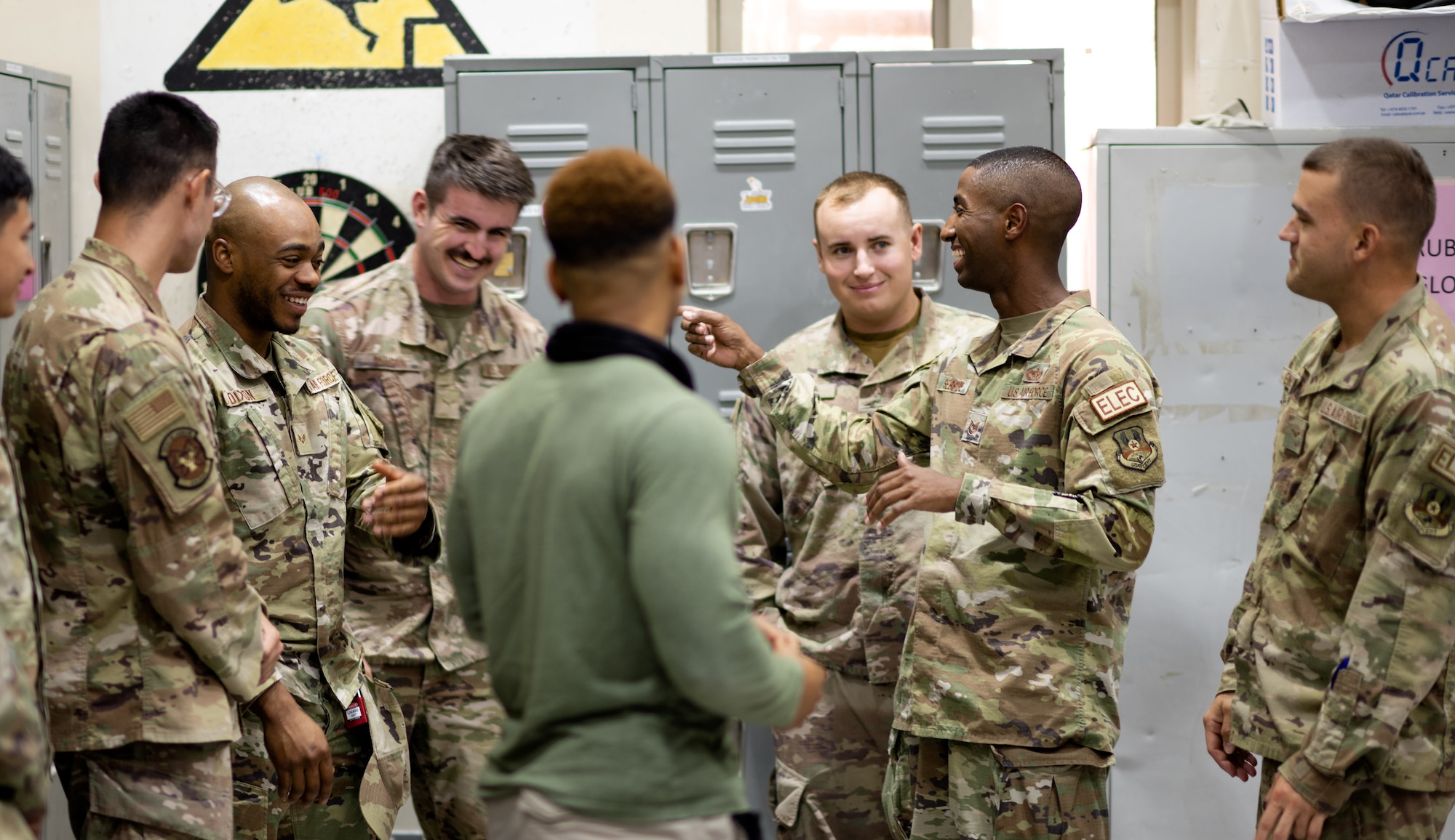 U.S. Air Force Tech. Sgt. Theodore Sebsibe, center right, briefs his team during a deployment to Al Udeid Air Base, Qatar, in 2023.
