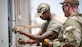U.S. Air Force Tech. Sgt. Theodore Sebsibe does electrical work during a deployment to Al Udeid Air Base, Qatar, in 2023.